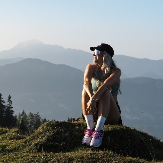 POP EYES athlete Romana on the mountain during a winter sunset.